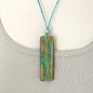 Preview: Nature-inspired leather pendant with hand-tooled grasses motive