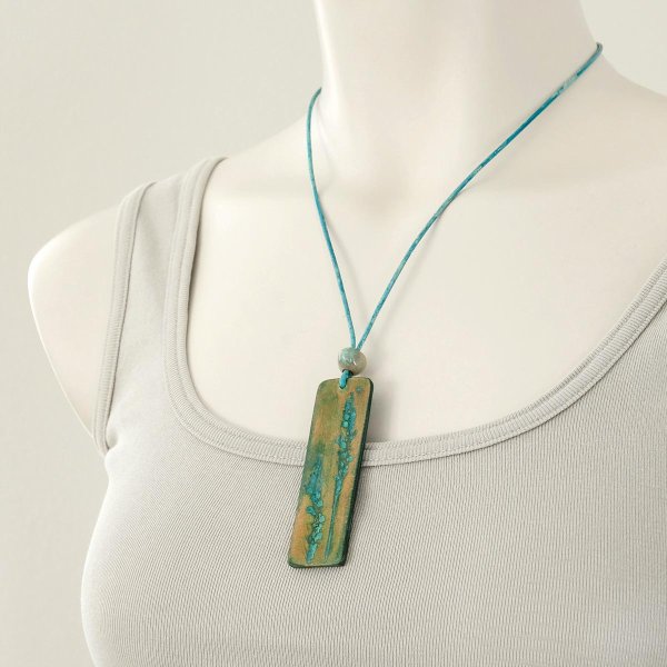 Preview: Teal leather pendant with hand-tooled botanical imprint