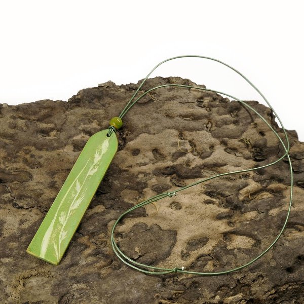 Preview: Sage green leather pendant on a