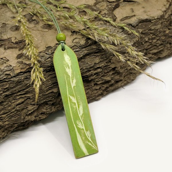 Adjustable necklace with light green leather pendant