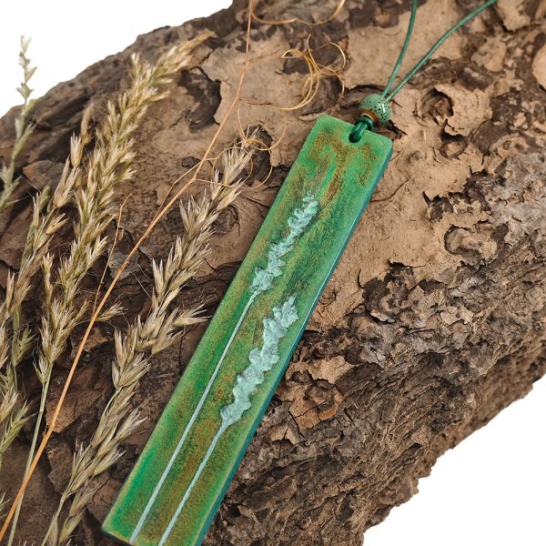 Leather necklace with hand-tooled grasses pendant