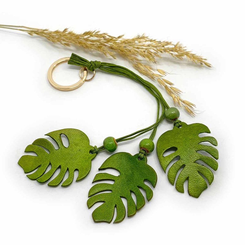 Leather Monstera Charm as a bag accessory