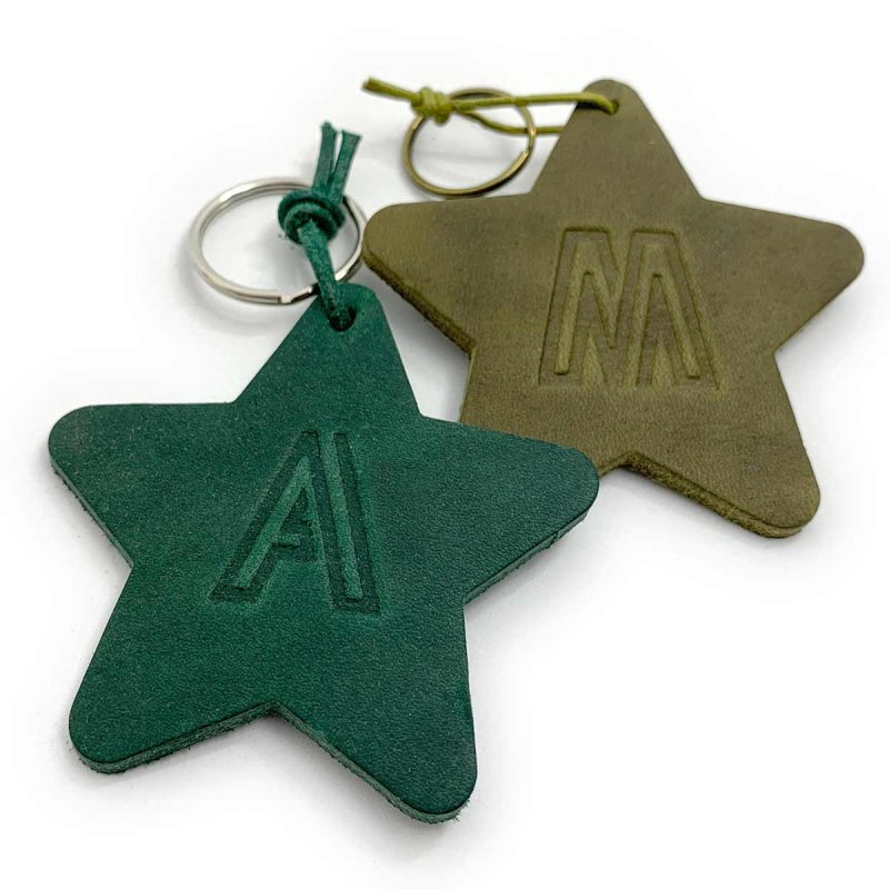 Green star-shaped leather keychain