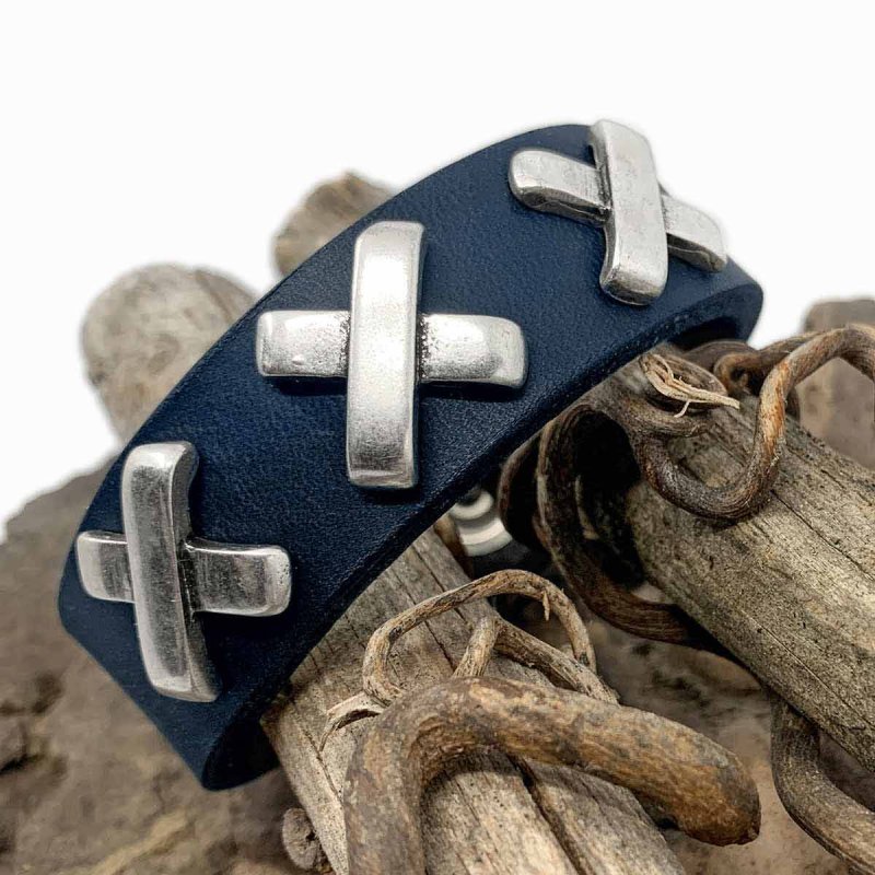 Blue leather wristband with decorative St. Andrew's cross rivets