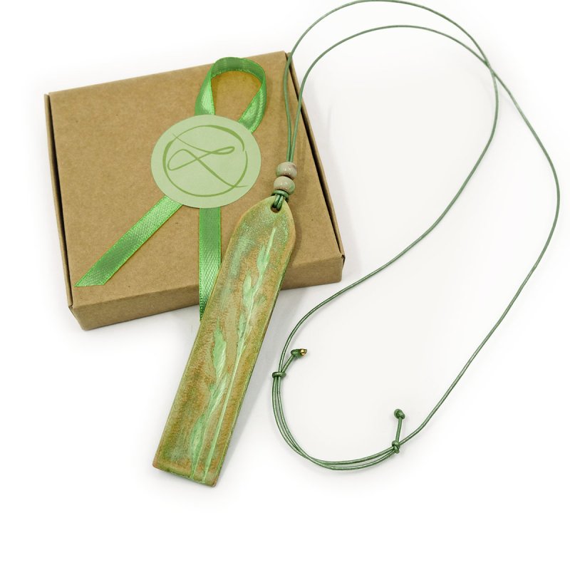 Bohemian style leather necklace with hand tooled pendant