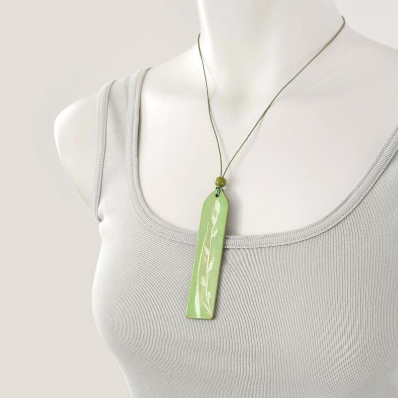 Light green leather pendant on adjustable necklace