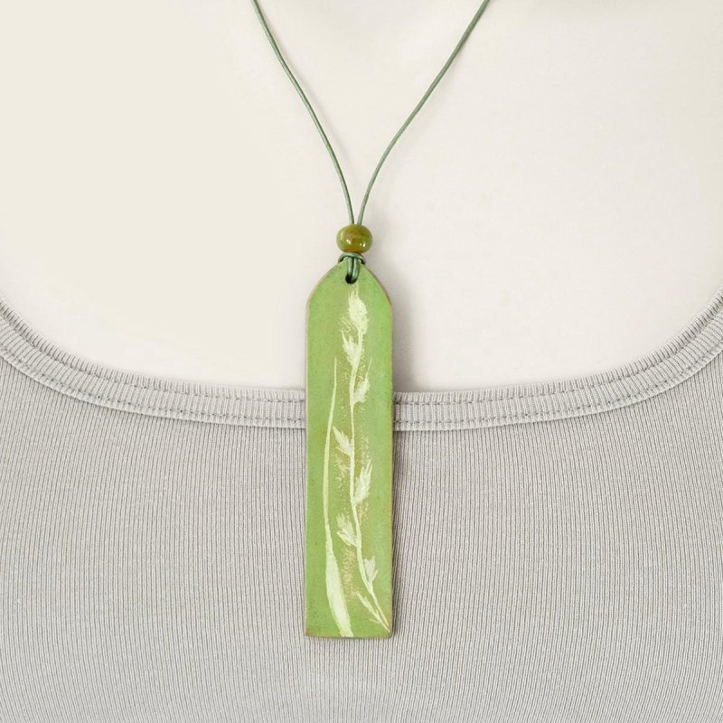 Leather pendant with adjustable necklace and botanical imprint