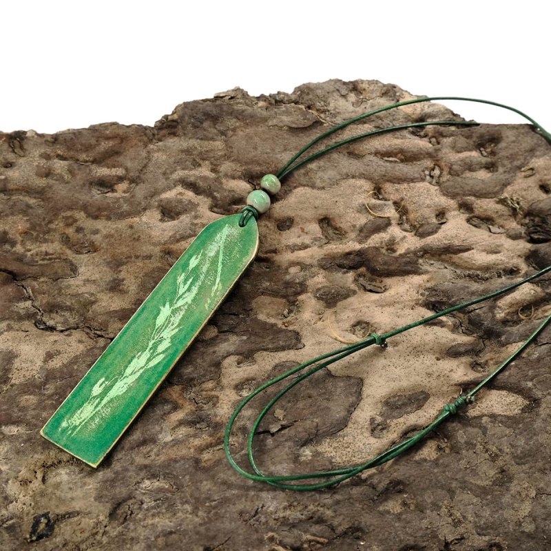 Adjustable boho style leather pendant on leather cord