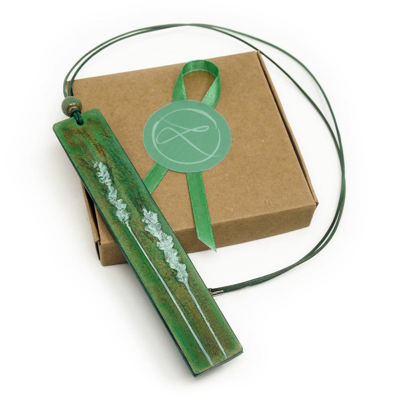 Seafoam green leather pendant with handtooled grasses motive